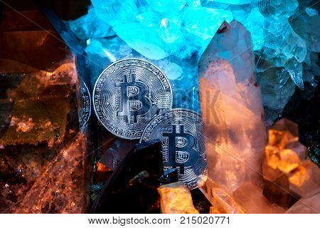 Silver bitcoin in a cave of precious stones. Bitcoin cryptocurrency.