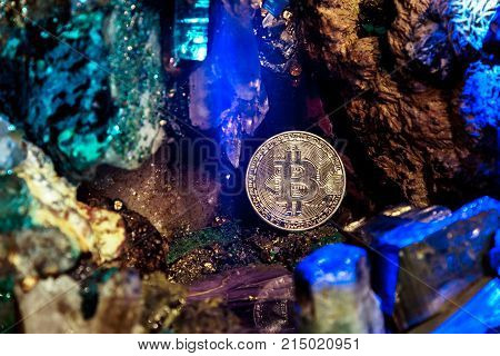 Golden bitcoin in a cave of precious stones. Bitcoin cryptocurrency.