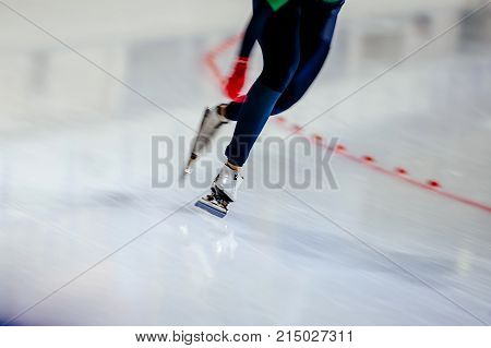 woman legs athlete speed skater blurred motion