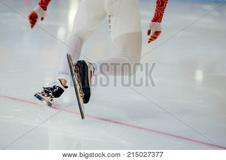 start legs men athletes speed skaters in competition speed skating