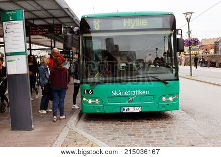 Malmo Sweden - August 24 2017: A green city bus in service for the public transportation company Skanetrafiken has stopped at the bus stop Centralen near the Malmo central railroad station.