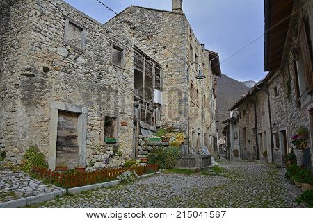 A small street in the hill village of Erto in Friuli Venezia Giulia north east Italy. The village is famous locally for having being evacuated following the 1963 Vajont Dam disaster.