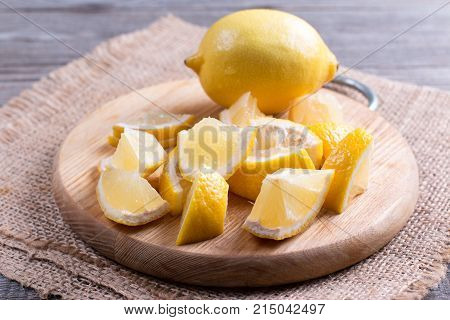 Lemon slices on a wooden cutting board