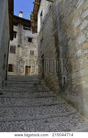 A small street in the hill village of Erto in Friuli Venezia Giulia north east Italy. The village is famous locally for having being evacuated following the 1963 Vajont Dam disaster.