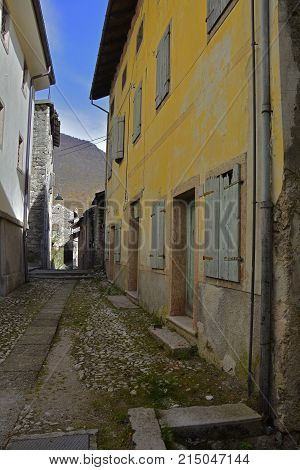 A small street in the hill village of Erto in Friuli Venezia Giulia north east Italy. The village is famous locally for having being evacuated following the 1963 Vajont Dam disaster.
