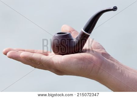 Tube for tobacco . In the park in nature