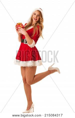 Full Length Portrait Of A Woman In Santa Calus Dress Holding A Present Isolated Over White Backgroun