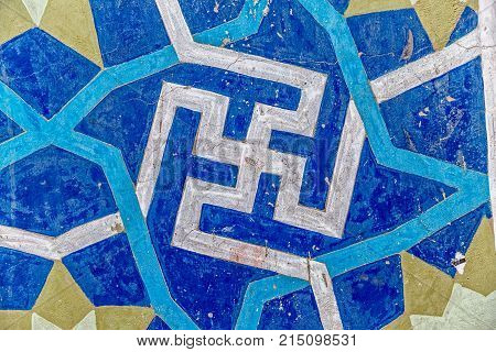 Old and traditional tiles as facade detail on the mosque in old city Yazd in Iran.