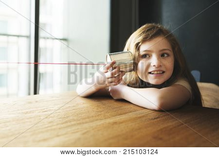 Little girl playing with a thin cna