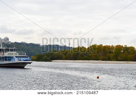 The ship sails along the Dnieper River. Autumn. Noon.
