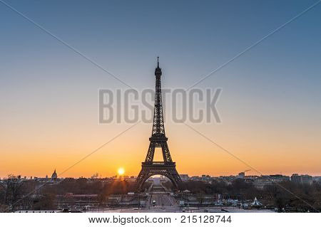 Landscape View Of A Warm Sunrise Over Paris And The Eiffel Tower With A Beautiful Orange To Blue Gra