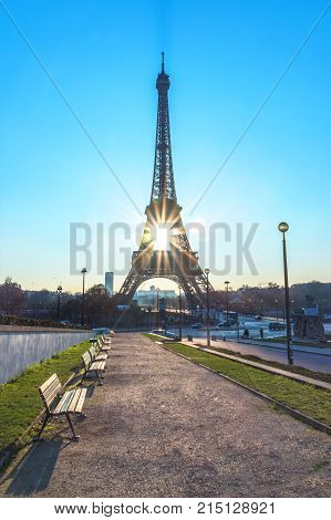 Early Morning Sunrise Behind And In The Middle Of The Eiffel Tower With The Reflection On The Founta