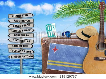 Concept of summer traveling with old suitcase and Argentina town sign