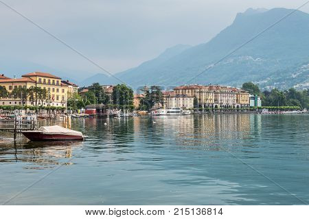 Lugano Switzerland - May 28 2016: View of the houses of Lugano with the Lugano lake and a swan - Lake Lugano Lugano Ticino Switzerland Europe.