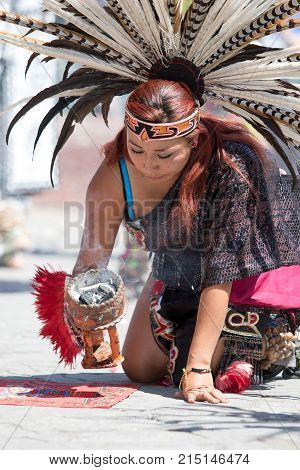March 6, 2016 San Miguel de Allende, Mexico: indigenous woman performing ritual at the Senior de la Conquista celebration