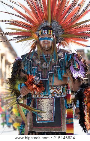March 6, 2016 San Miguel de Allende, Mexico: indigenous man dressed in traditional costume performing ritual dance at the Senior de la Conquista celebration
