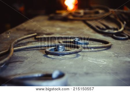 forged products are on the table in the forge workshop