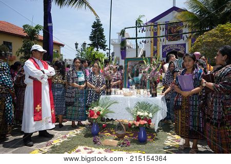 March 25, 2016 San Pedro la Laguna, Guatemala: people at a pray station in waiting for the procession to arrive at Easter celebration