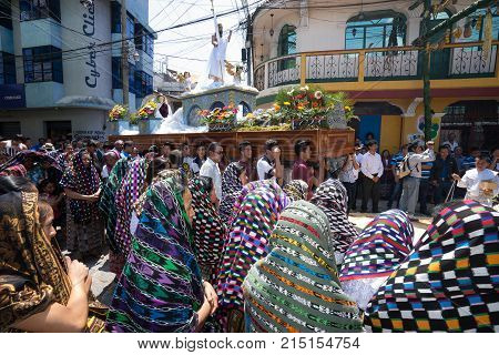 March 27, 2016 San Pedro la Laguna, Guatemala: a float is being carried through the street of the Mayan town during Easter procession