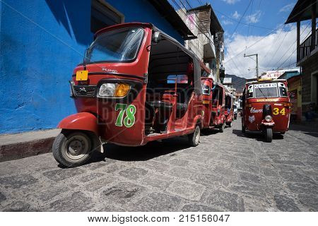 April 6,2016, San Pedro la Laguna,Guatemala: tuktuks lining up waiting for customers beside the local market very popular as a low budget transportation