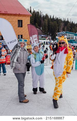 Sheregesh, Kemerovo region, Russia - April 22, 2017: Grelka Fest is a sports and entertainment activity for ski and snowboard riders in carnival costume. Young people in carnival costumes.