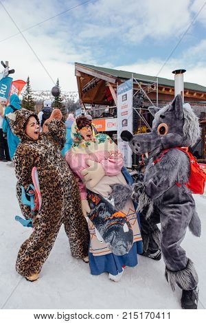 Sheregesh, Kemerovo region, Russia - April 22, 2017: Grelka Fest is a sports and entertainment activity for ski and snowboard riders in carnival costume. Young people in carnival costumes.