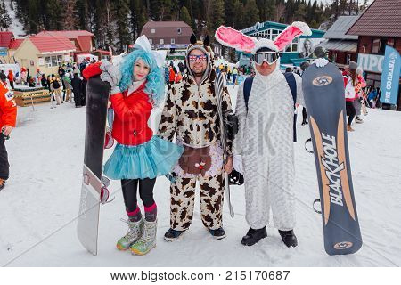 Sheregesh, Kemerovo region, Russia - April 22, 2017: Grelka Fest is a sports and entertainment activity for ski and snowboard riders in carnival costume. Young people in carnival costumes.