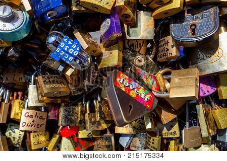 PARIS, FRANCE - CIRCA JUNE 2014: Close up love padlocks hanging on bridge