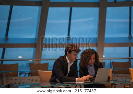 Business people having meeting around table in modern office.