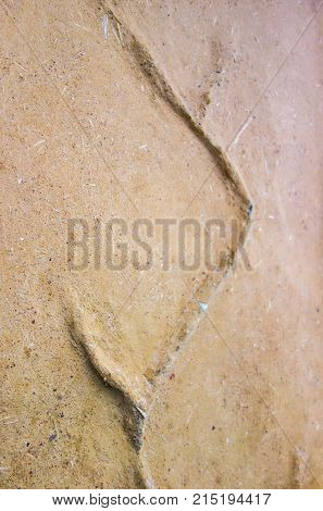 Natural material building with artistic artwork on clay and sand mixure wall in Estonia