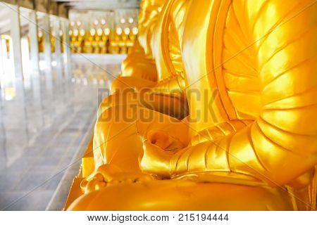 Golden Buddha statue meditation in measure Thailand.