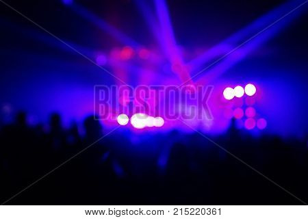 Texture Blur Scene Multicolored Lights And Smoke In Concert With Silhouettes Of Peoplebackground For