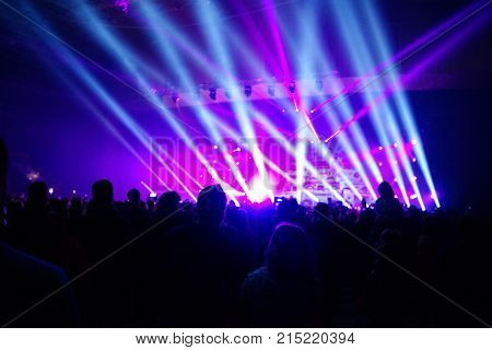 Texture Blur Scene Multicolored Lights And Smoke In Concert With Silhouettes Of Peoplebackground For