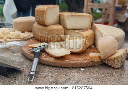 Freshly chopped cheese on the counter of the store. Food