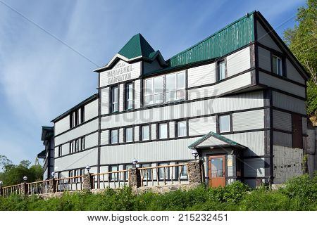PETROPAVLOVSK-KAMCHATSKY CITY KAMCHATKA PENINSULA RUSSIAN FAR EAST - JUNE 16 2017: Summer view of facade building of Hotel Chief of Kamchatka (Nachalnik Kamchatki) in Petropavlovsk-Kamchatsky City.