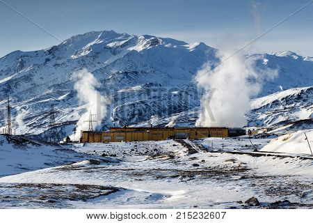 MUTNOVSKY VOLCANO KAMCHATKA PENINSULA RUSSIAN FAR EAST - Oct 22 2017: Winter view on Mutnovskaya Geothermal Power Plant (Mutnovskaya GeoPP-1) Geotherm JSC (RusHydro) at foot of active volcano.