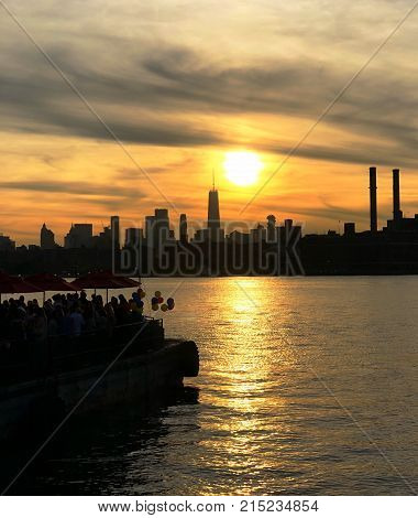 Nice sunset close to the river and a boat party