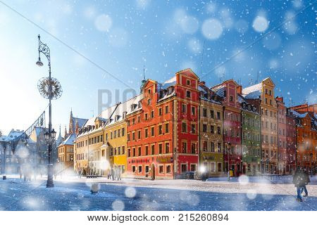 Multicolored traditional historical houses on Market square in the winter snowy morning, Old Town of Wroclaw, Poland