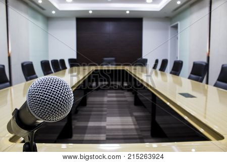 Microphone and modern table boardroom with chair black.( luxurious meeting room in a big corporation )