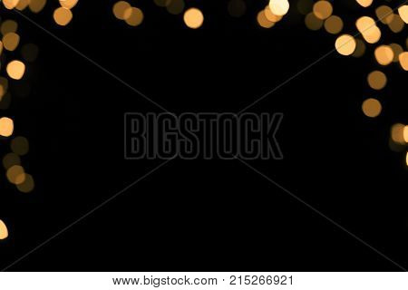 Abstract border with gold sparkle on black background