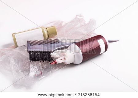 Close-up Of Chemical Hair Color Dye Set With Comb Brush