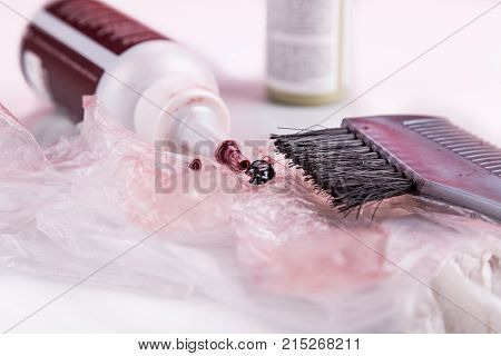 Close-up Of Chemical Hair Color Dye Set With Comb Brush