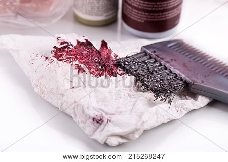 Close-up Of Chemical Hair Color Dye Set With Comb Brush