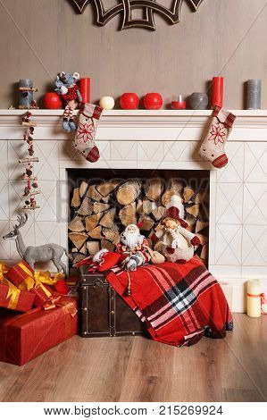 Cozyness And Home Comfort. Decorated Fireplace With Firewood. Winter Holidays Room Interior, Christm