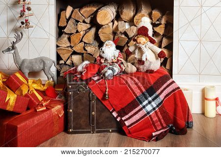 Cozyness And Home Comfort. Decorated Fireplace With Firewood. Winter Holidays Room Interior, Christm