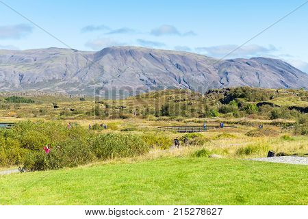 Tourists Walk To Logberg In Thingvellir Park