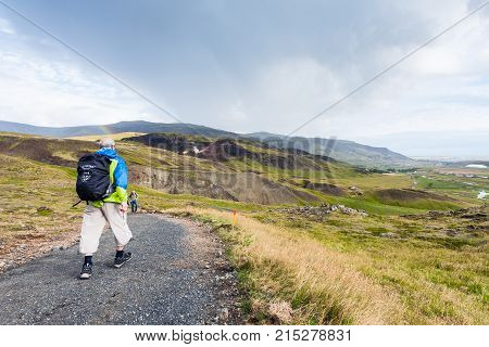 Tourists Hike On Trail In Hveragerdi In Iceland