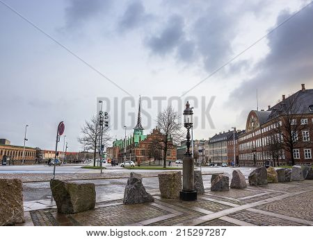 Square in european capital in winter rainy day
