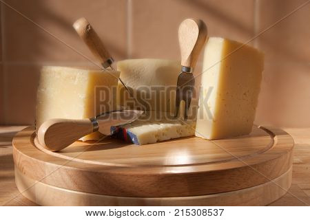 parmigiano, traditional italian cheese platter, with fork and kinfe