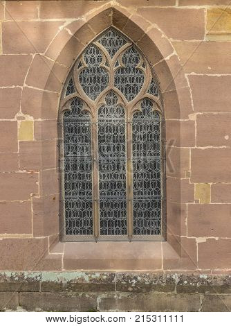 MAULBRONN, GERMANY -19, okt. 2017: couple sitting at gotic style houses window at the monastery courtyard in Maulbronn.